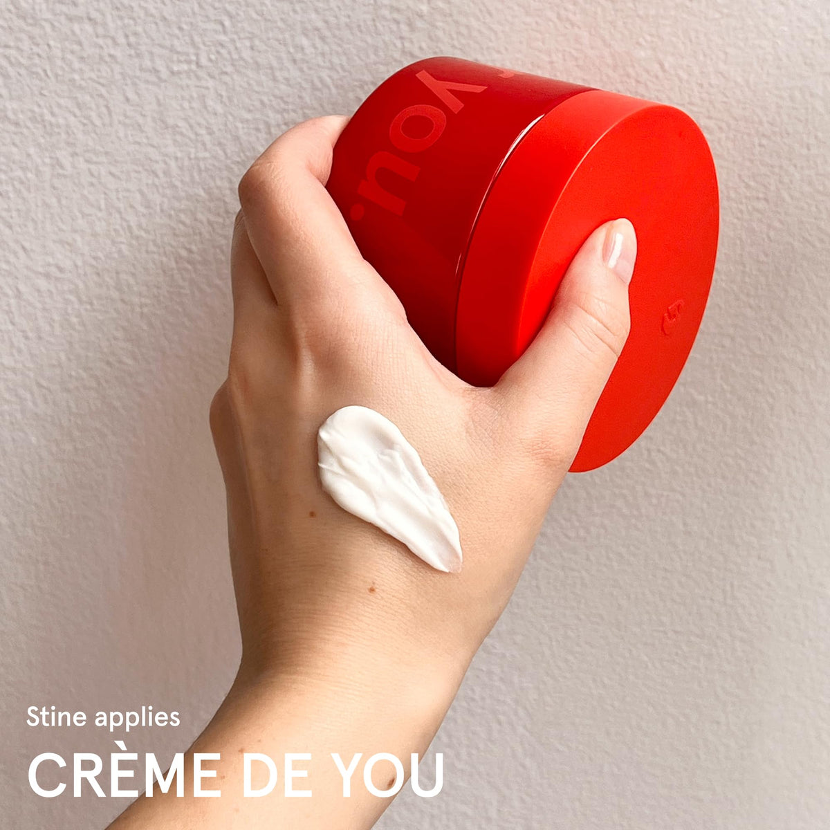 Glossier cream held in hand for size comparison and easy portability