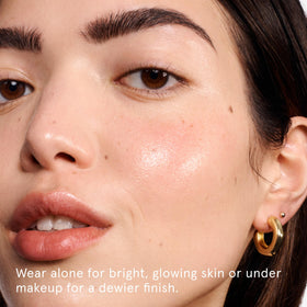 Drop of Glossier Futuredew oil-serum texture highlighting luminous finish benefit