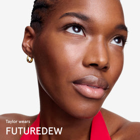 Glossier Futuredew next to a one-ounce reference object showing size and portability benefit