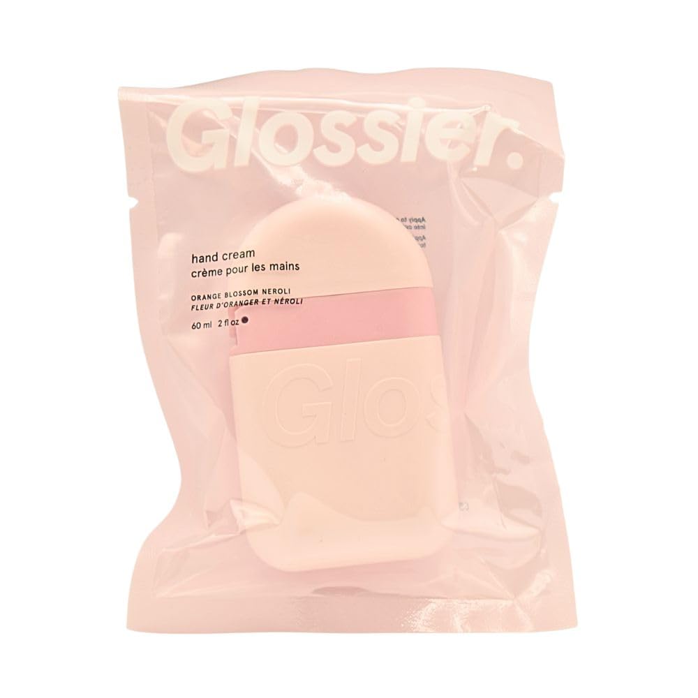 Glossier hand cream front pod showing compact travel packaging and easy squeeze