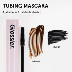 Glossier Lash Slick size scale comparison next to coin showing compact 0.29 oz portability