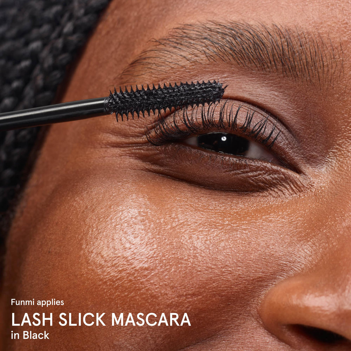 Glossier Lash Slick True Black swatches on skin showing deep color payoff and true-black intensity