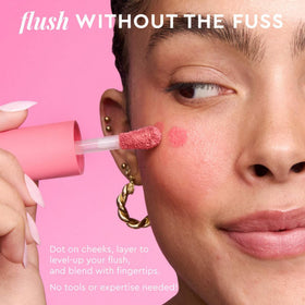 Glow Recipe doe-foot applicator close-up with tinted serum, showing precise, easy application