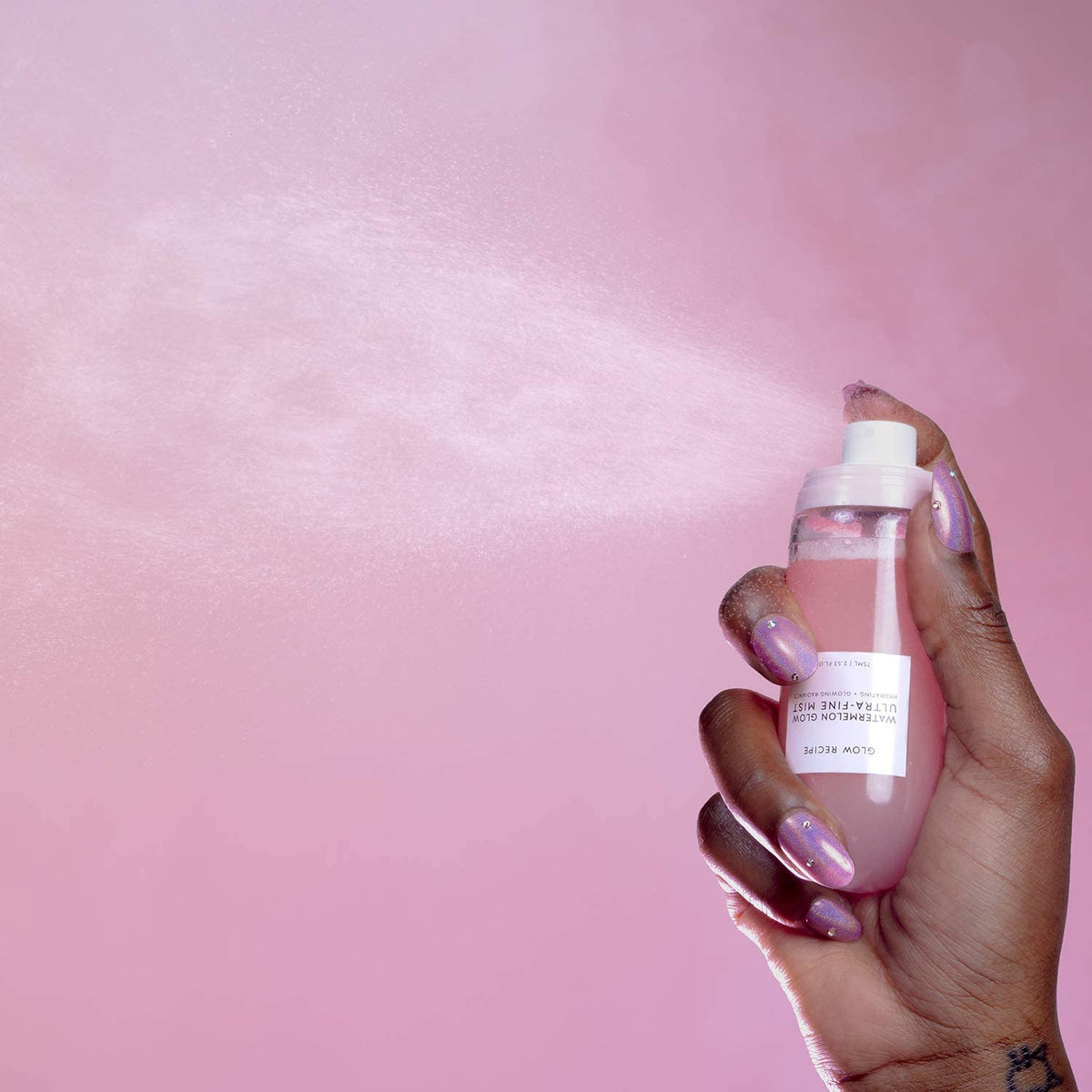 Glow Recipe bottle held in hand showing compact 75ml travel size