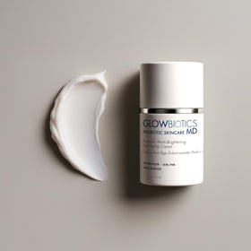 Glowbiotics lotion applied on model's cheek showing reduced redness and dewy finish