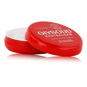 Hand applying Glysolid cream to rough skin illustrating brand relief and smoother finish