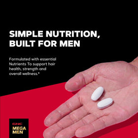 GNC bottle open with caplets spilled showing daily supply convenience