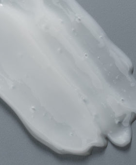 GO247 shampoo texture pouring from bottle showing rich lather and body benefit