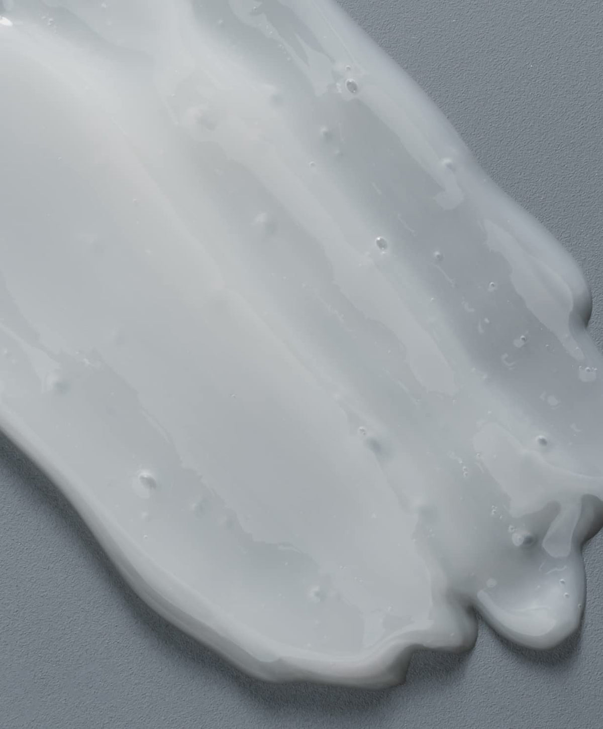 GO247 creamy shampoo foam on hand demonstrating lather and texture