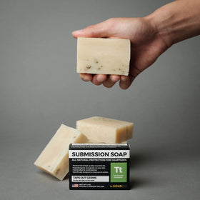 Gold BJJ gym bag lifestyle scene with soap ready for post-roll cleansing convenience