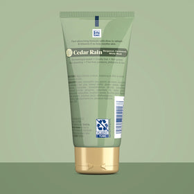 Gold Bond cream texture on fingertip illustrating quick-absorbing, non-greasy feel