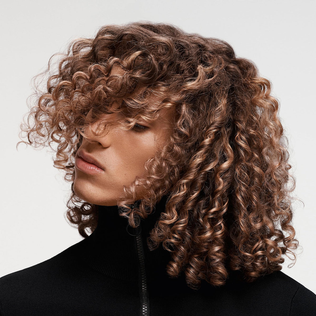 Goldwell in-bathroom lifestyle shot showing easy daily use and refreshed hair feeling