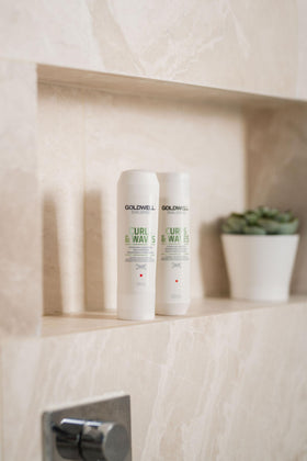 Goldwell 1L bottle beside 250ml for scale and refill convenience