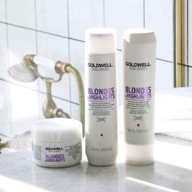 Goldwell size comparison with hand illustrating the 200ml travel-ready bottle