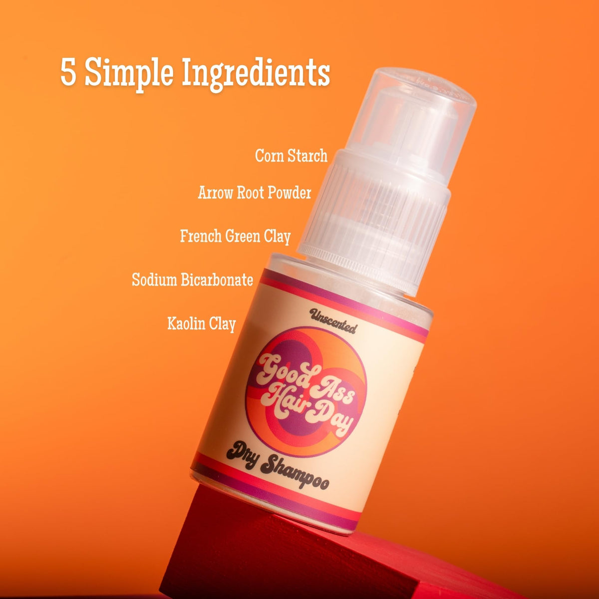 Good Ass Hair Day application on roots with fingertips illustrating targeted oil absorption benefit