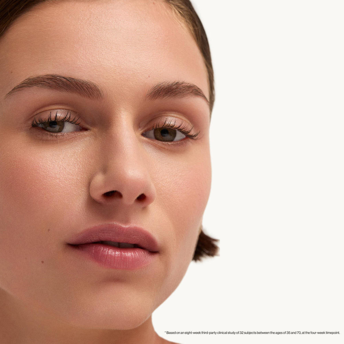 goop Beauty serum on bathroom counter in evening skincare routine scene