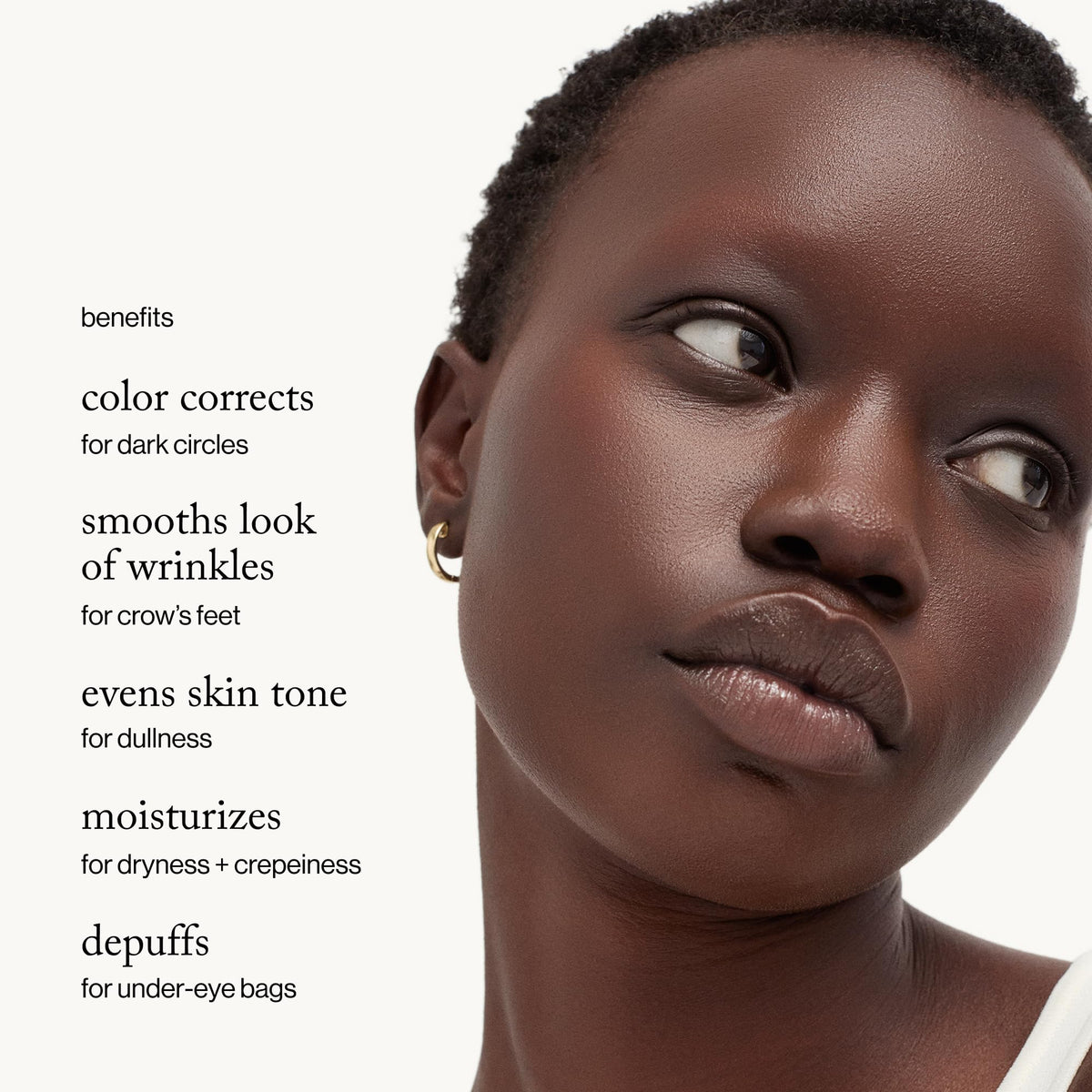 goop cream texture visible on fingertip, shows lightweight gel-cream and quick absorption