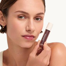 goop hydra-barrier gel gloss in hand lifestyle shot showing easy daily use and comfortable hold benefit