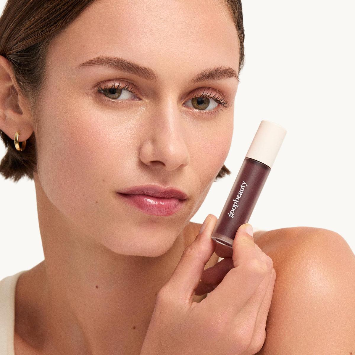 goop Hydra-Barrier on bathroom counter in lifestyle scene showing daily use benefit