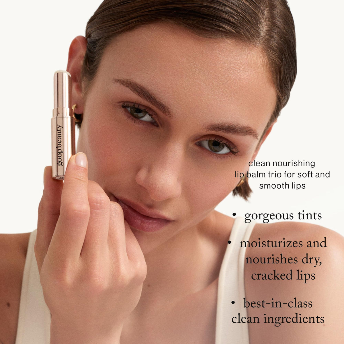 goop lip balm clear tube closeup highlighting smooth balm surface benefit: glossy, non-greasy finish
