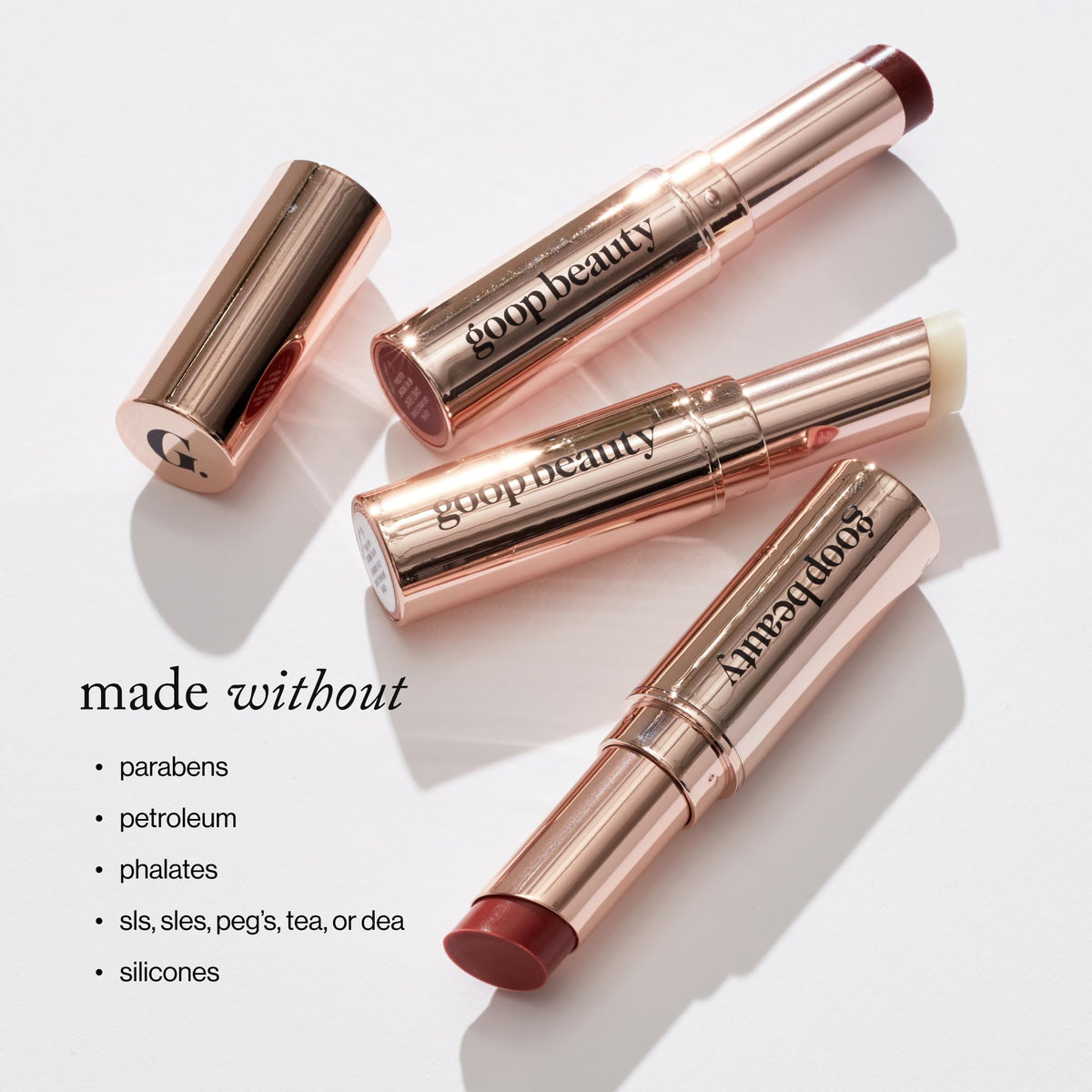 goop lip balm ingredients flatlay of botanical oils and shea butter benefit: plant-powered hydration