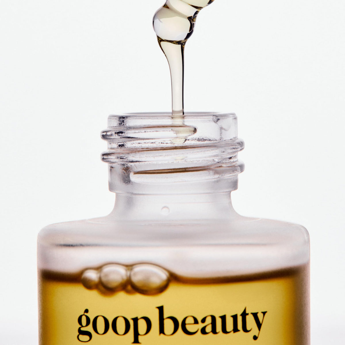 goop applying two drops on hand to show absorbency and softening effect