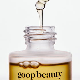 goop applying two drops on hand to show absorbency and softening effect