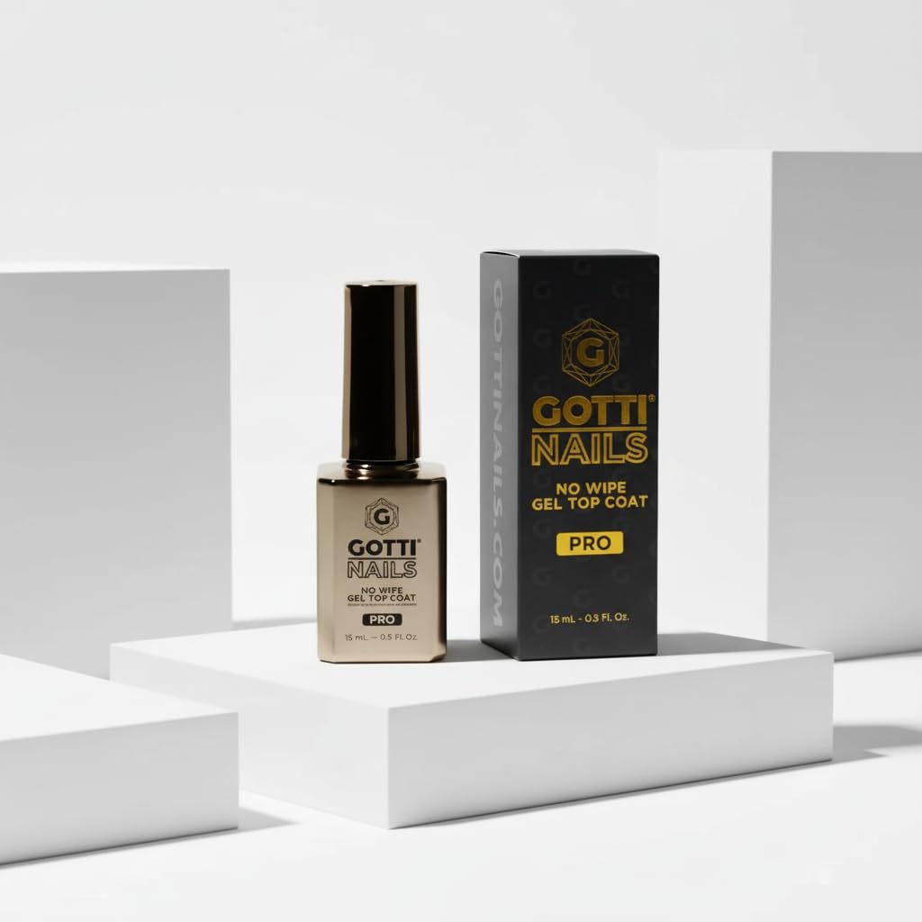 Gotti Nails brush applying clear top coat for smooth, streak-free coverage