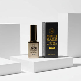 Gotti Nails brush applying clear top coat for smooth, streak-free coverage