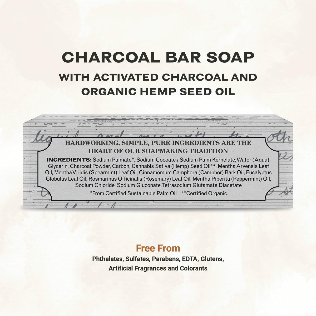 Close-up texture of charcoal bar showing grain and hemp oil sheen, The Grandpa Soap Company benefit