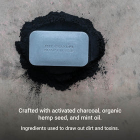 Grandpa Soap Company charcoal bar lathered in hand demonstrating rich foam and easy rinsing