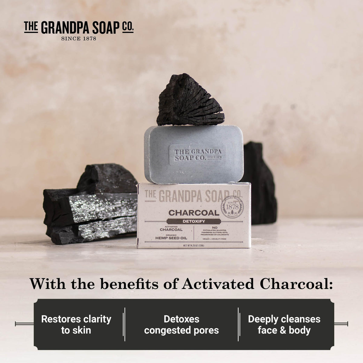 Lathered charcoal soap on hand demonstrating foam and cleaning action, The Grandpa Soap Company refreshing feel