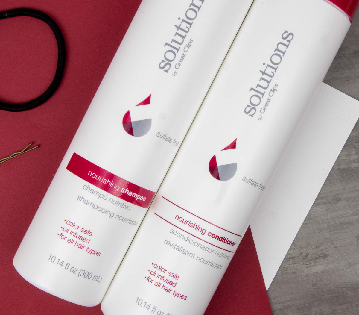 GREAT CLIPS pump close-up with argan oil droplet highlighting nourishment