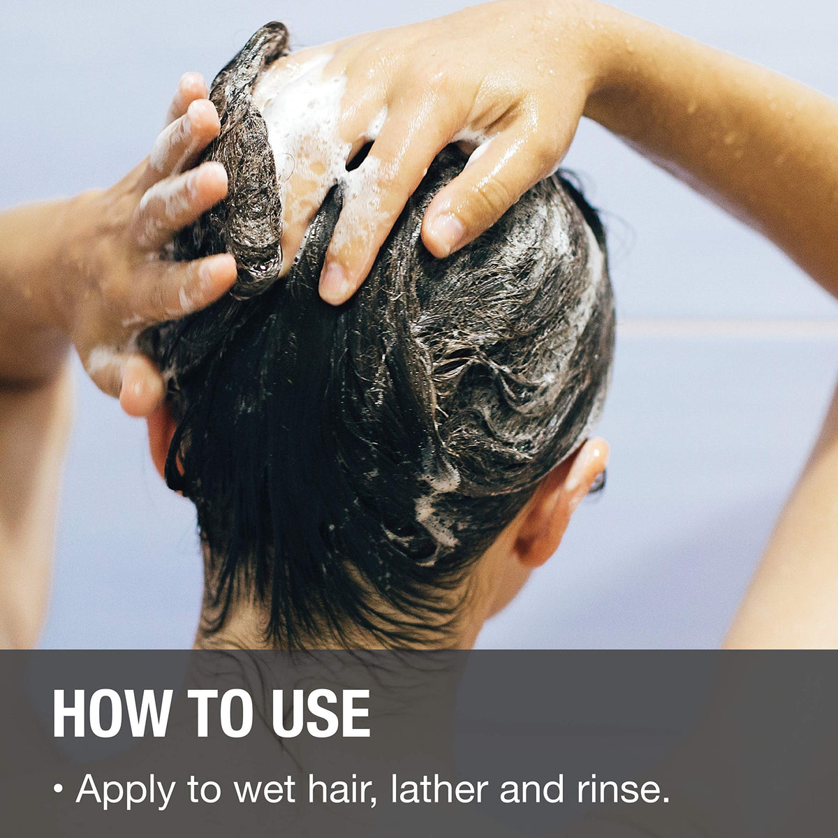 GREAT CLIPS 10oz bottle held in hand showing compact size and travel-friendly benefit