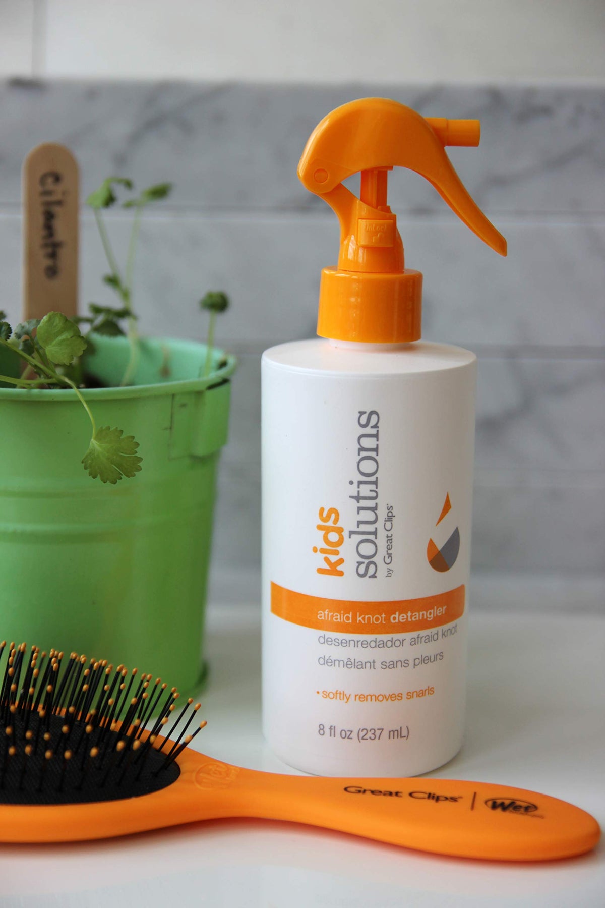 Great Clips spray nozzle close-up demonstrating precise misting for gentle application