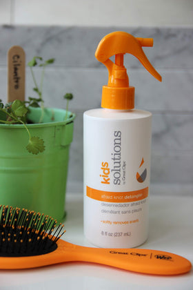 Great Clips spray nozzle close-up demonstrating precise misting for gentle application