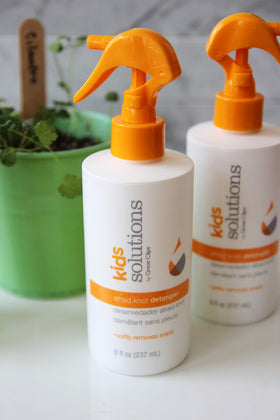 Great Clips spray texture on hand illustrating lightweight moisturizing benefit