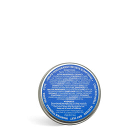 Green Goo tin next to coin showing scale and travel-friendly, long-lasting supply