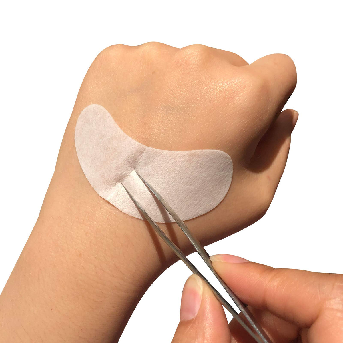 GreenLife pad holding lower lashes during application for precise work