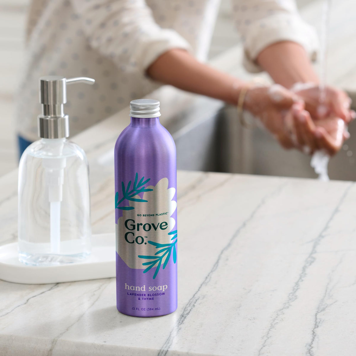 Grove Co. pouring refill into dispenser for easy replenishment