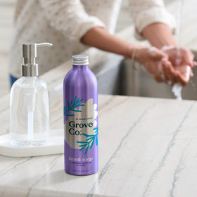 Grove Co. pouring refill into dispenser for easy replenishment