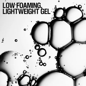 Grown Alchemist body wash in a shower setting suggesting daily ritual benefit