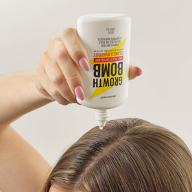 Growth Bomb dispensing serum from dropper demonstrating easy targeted application