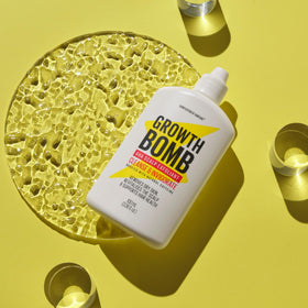 Growth Bomb being applied pre-shampoo in shower to remove buildup benefit