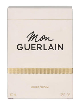 Guerlain Mon Guerlain spray in use mist over skin illustrating easy application and lasting scent