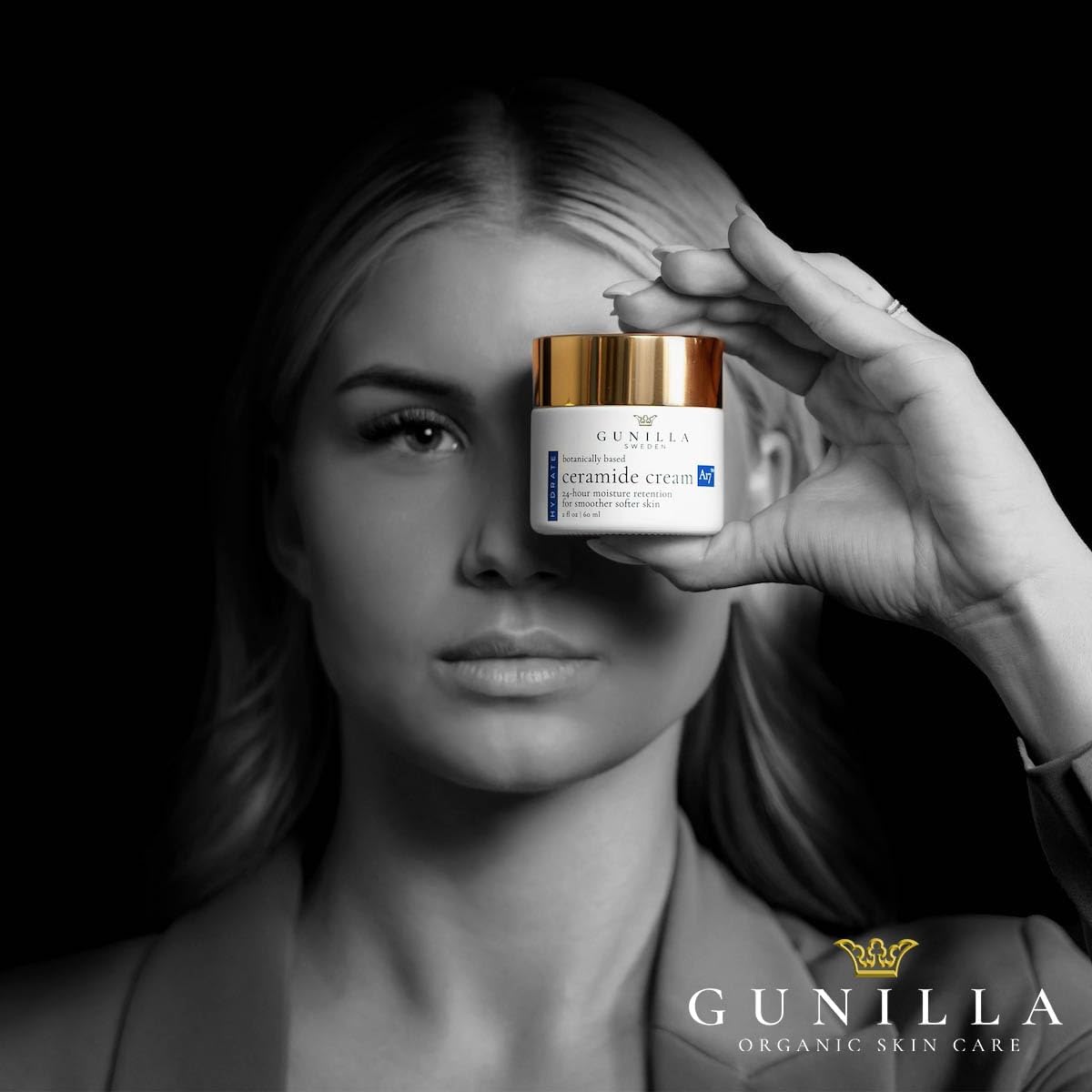 Gunilla jar next to coin to show the two-ounce size and travel-friendly benefit