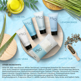 H2O Therapy toiletries styled in a hotel bathroom suggesting guest-ready presentation