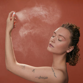 HABIT fine sunscreen mist in air demonstrating even weightless coverage