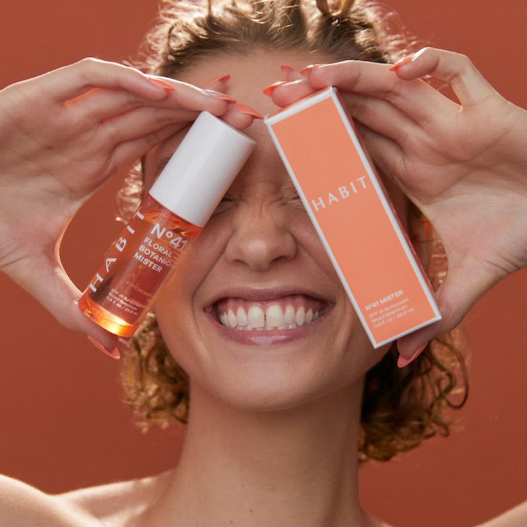 HABIT travel size bottle in hand illustrating pocketable on-the-go SPF