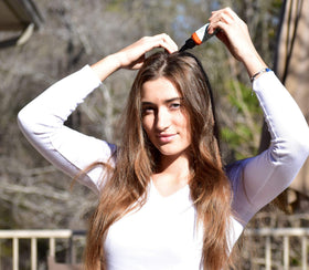 Hair Dance used outdoors after workout for quick refresh on the go